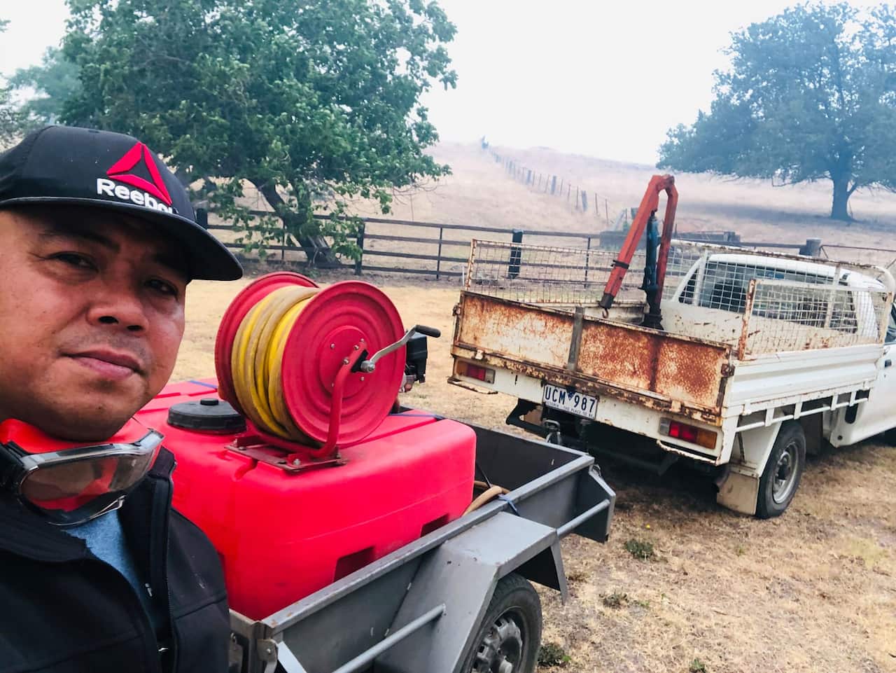 Sherwin Malenab and the vehicle used in putting out the fires thqat closed in on Corryong Health
