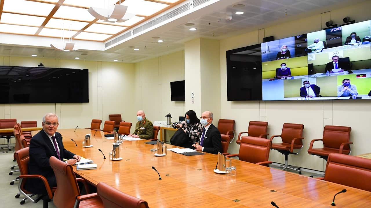 Prime Minister Scott Morrison, Australia’s Chief Medical Officer and COVID-19 Taskforce Commander attend a national cabinet meeting