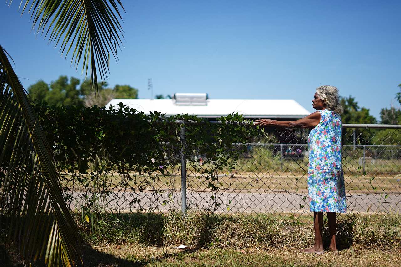 Helen Fejo-Frith standing at her back fence