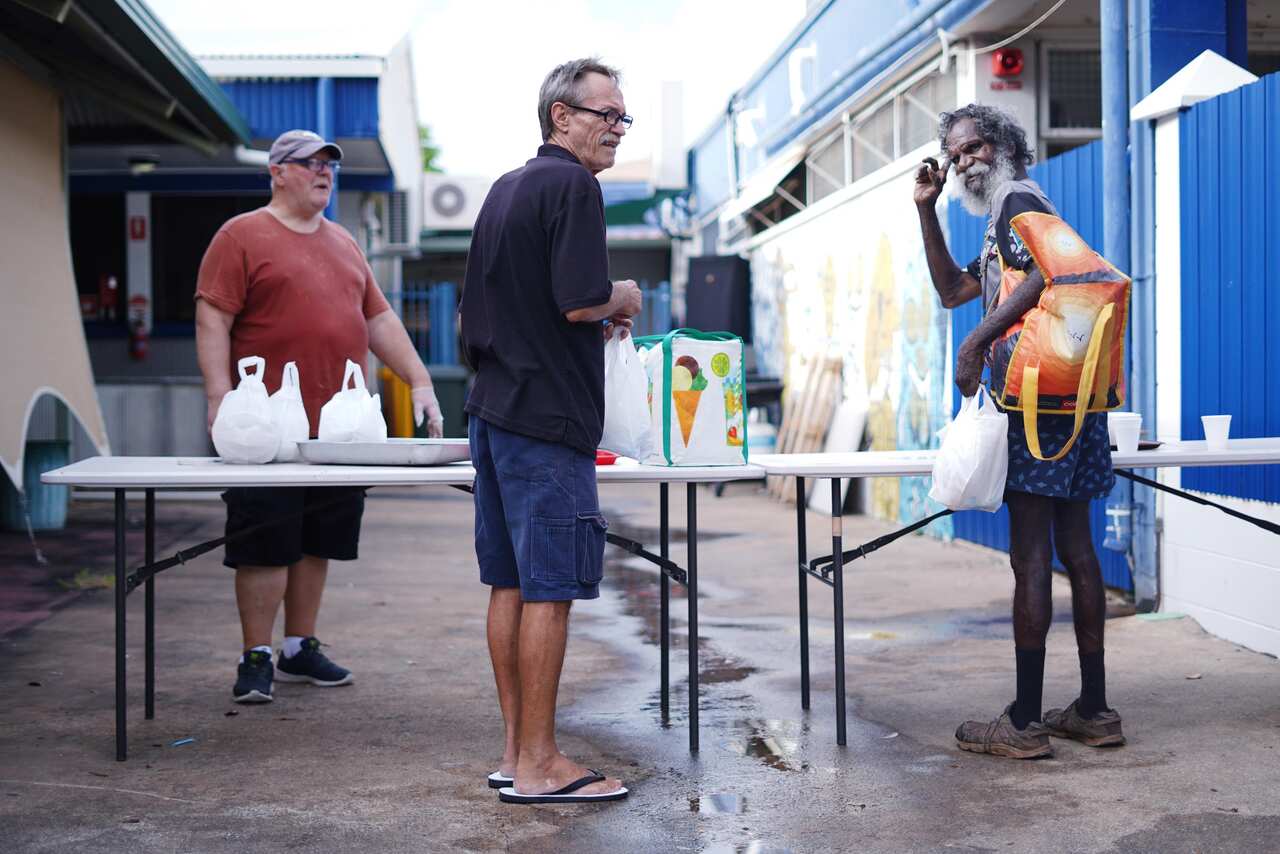 Volunteers helping give out food to the homeless in Darwin