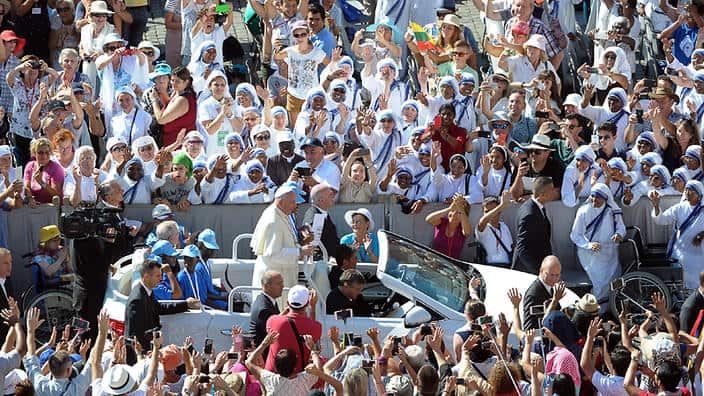 Pope Francis is driven through the crowd in St. Peter's Square at the Vatican 