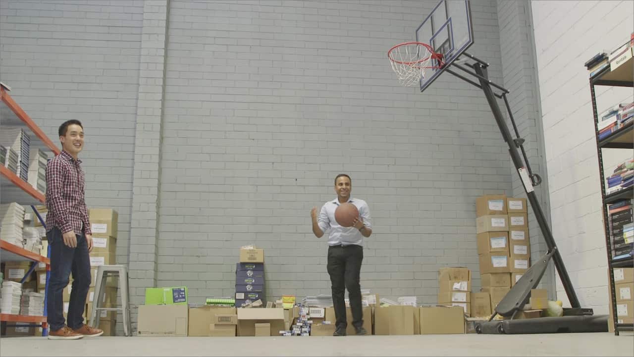 Ahmed Haider and Zookal Australia's managing director Jermoy Lowe know the importance of having fun while working and take a break by shooting hoops.