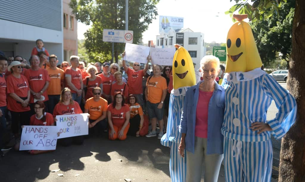 Former ABC Playschool presenter Benita Collings is joined by the Bananas in Pyjamas in front of a crowd funded billboard calling for the protection of the ABC, in the heart of Malcolm Turnbull's electorate in Rushcutters Bay, Sydney, Jan 30, 2014. (AAP)
