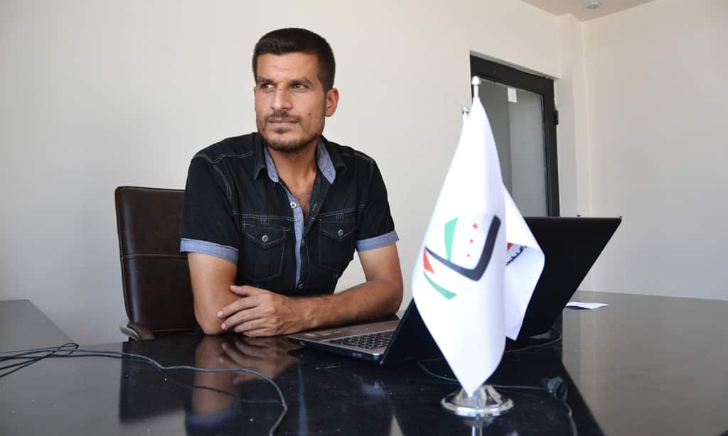 Camp spokesman Ahmad Smair, 27, in the offices of an unnamed camp for Syrian-based Palestinian refugees near the Turkish-Syrian border, July 27, 2014. (Photo: Matthew Clayfield)