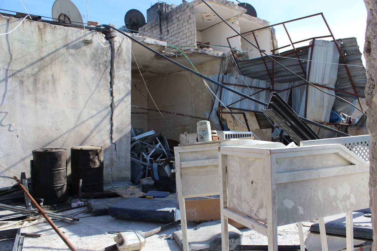 The roof of a hospital after a barrel bomb was dropped on the building next door. (Photo: Sophie Cousins)