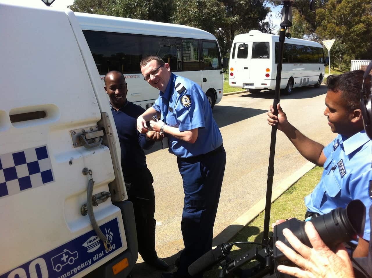 'Shoot’s over – let’s get those handcuffs off': Police with an actor in the educational film (Ryan Emery)