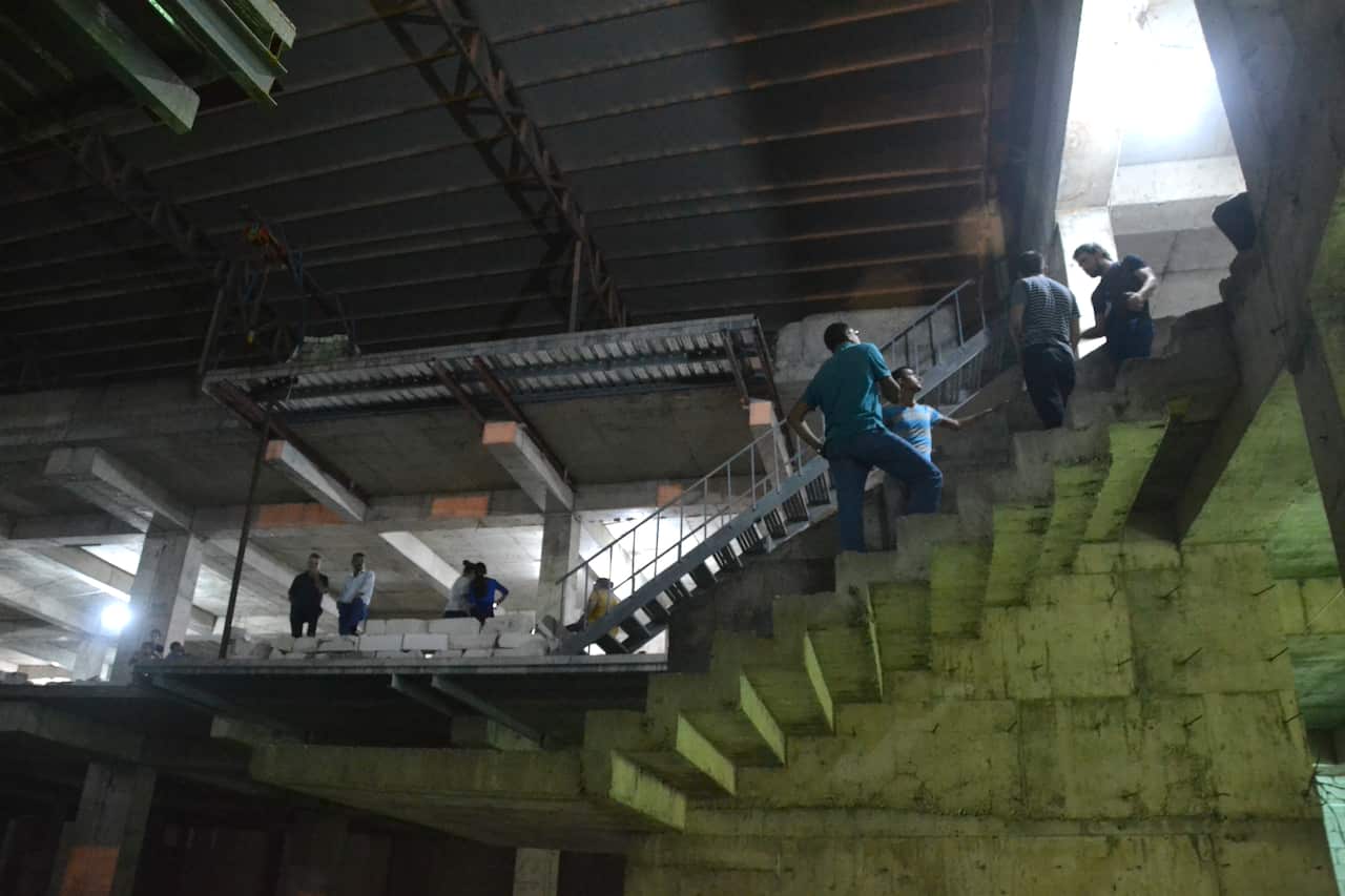 Iraqi Christians in a half-built apartment building in Ankawa, the Christian quarter of Erbil, Iraqi Kurdistan. Five hundred people from the Christian village of Karamlish are currently being housed in this building. (Matthew Clayfield)
