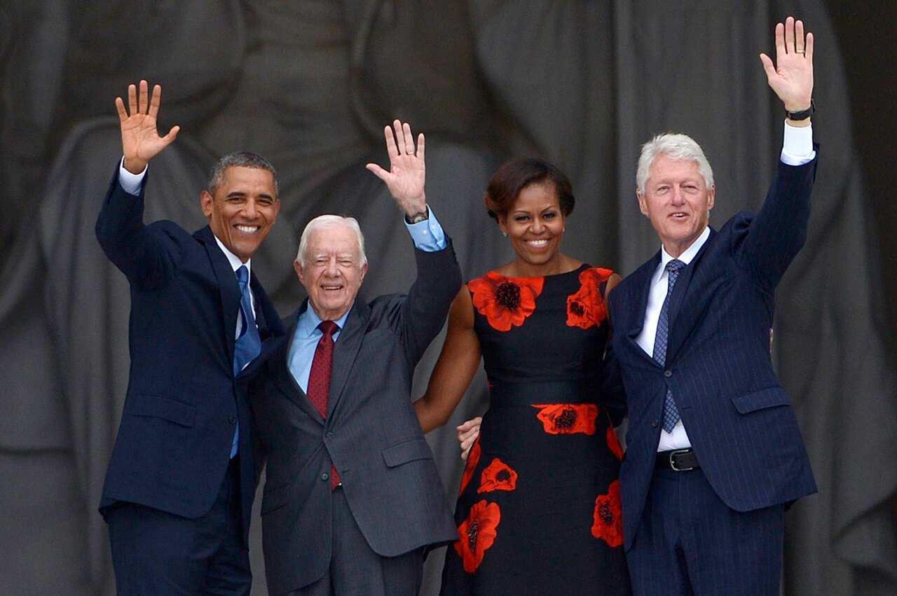 US President Barack Obama, First Lady Michelle Obama and former US Presidents Jimmy Carter and Bill Clinton.