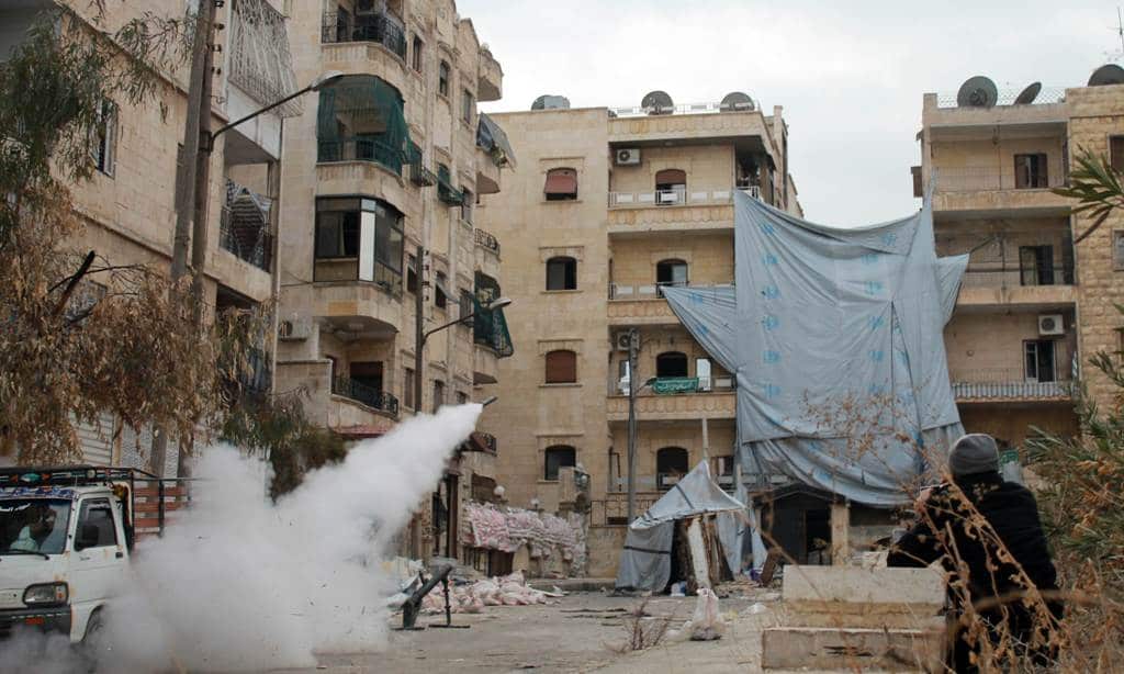 Opposition fighters fire a homemade rocket launcher during clashes with government forces in the northern Syrian city of Aleppo on January 12, 2014. Syrian troops seized a rebel-held town north of Aleppo the previous day. (AFP)