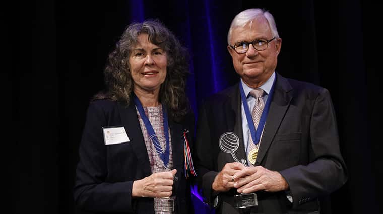 Justice Peter McClellan and Chrissie Foster receive their awards.