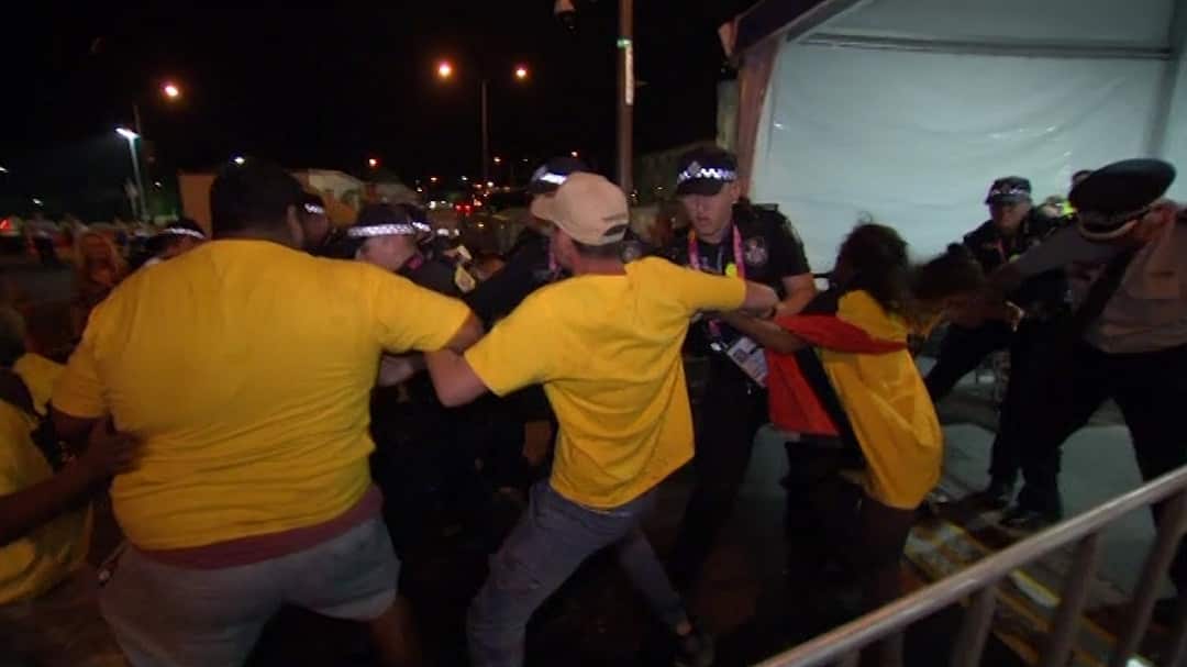 Indigenous activists scuffle with police.