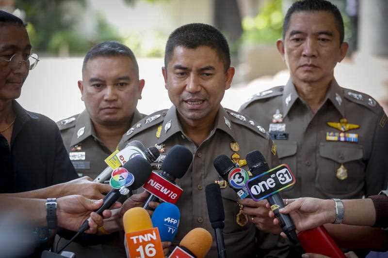 Thai Immigration Police Chief Surachet Hakparn (C) talks to members of the press outside the Saudi embassy.