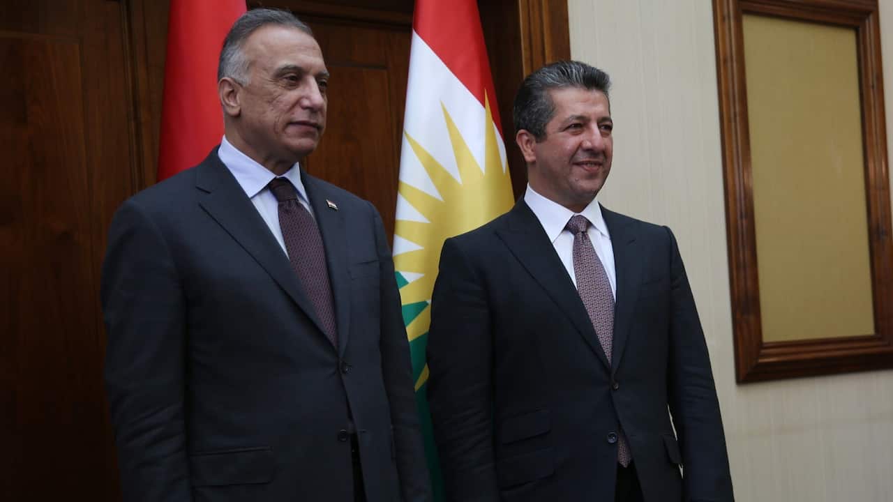 The Prime Minister of the Kurdistan Region Masrour Barzani (R) welcomes Iraqi Prime Minister Mustafa Al-Kadhimi (L) 