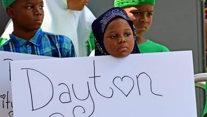 Crowds gather for a prayer vigil in downtown Dayton for the victims of a shooting in the Oregon District of Dayton, Ohio.