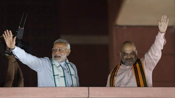 Indian Prime Minister Narendra Modi (L) and Bharatiya Janata Party (BJP) President, Amit Shah (R) at party headquarters in New Delhi.