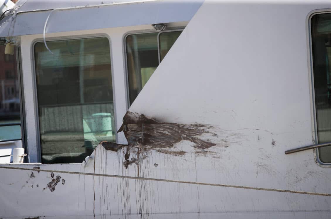 A partial view of the tourist boat that was struck by a cruise line ship in Venice, Italy, Sunday, June 2, 2019 (AAP)