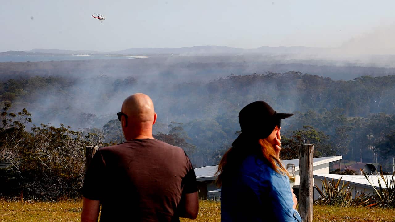 A water bombing helicopter near Forster (AAP)