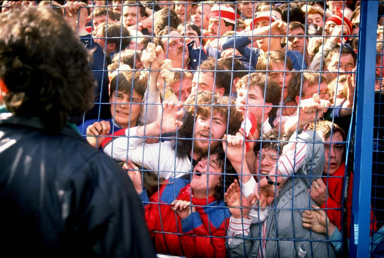 Supporters are crushed against the barrier as disaster strikes at Hillsborough Stadium in Sheffield, England. (Getty)