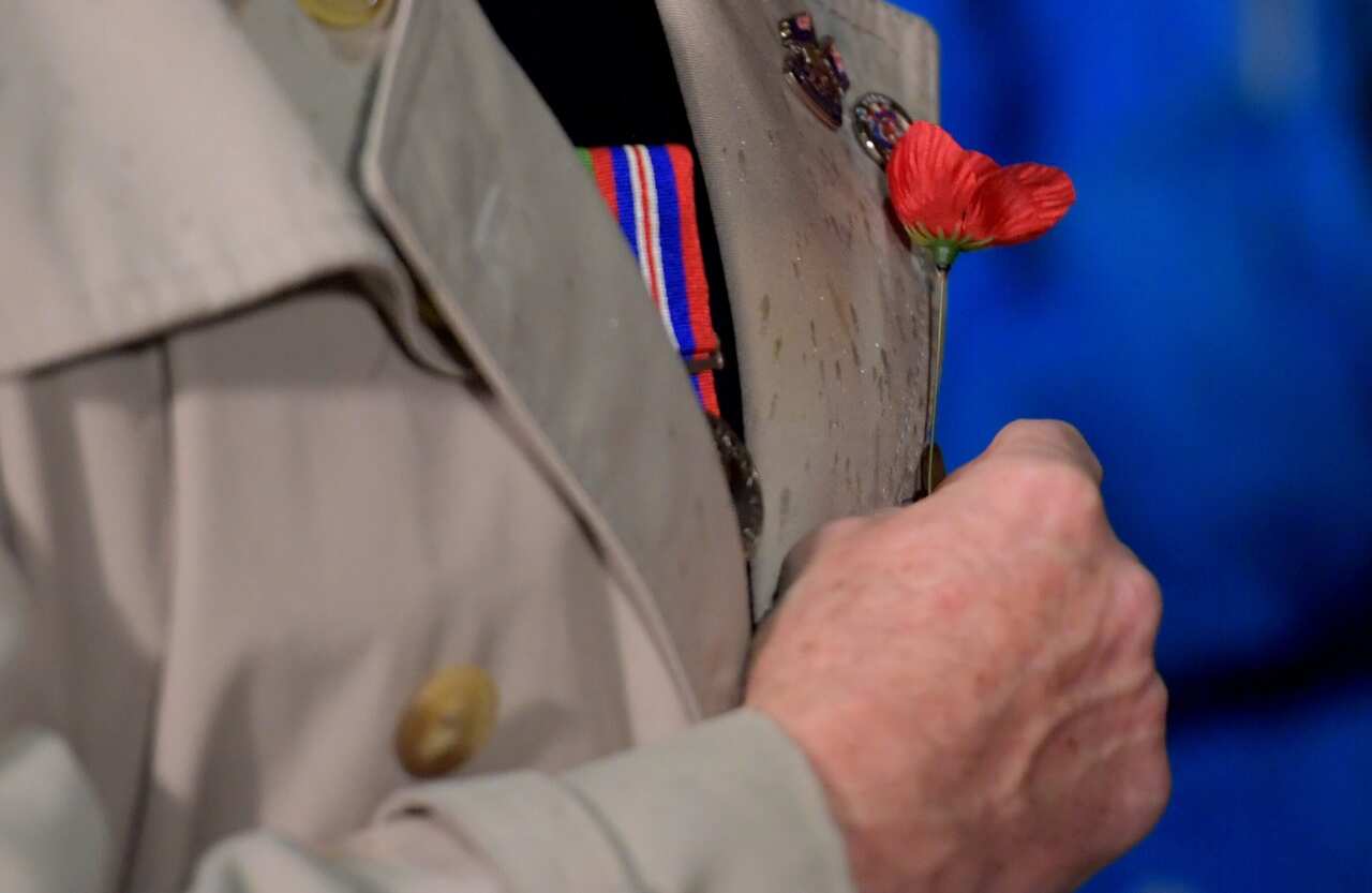 The public lay poppies after the Anzac Day Dawn Service during Anzac Day commemorations at Melbourne's Shrine of Remembrance in Melbourne (AAP)