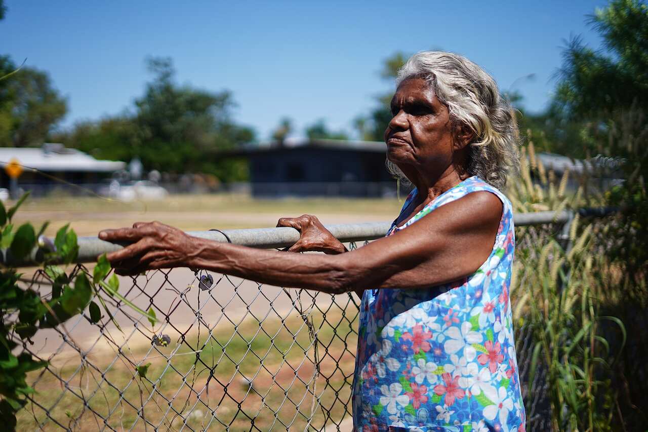 Helen Fejo-Frith standing at her fence close up           