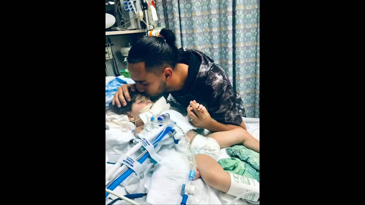 Ali Hassan with his child Abdullah.