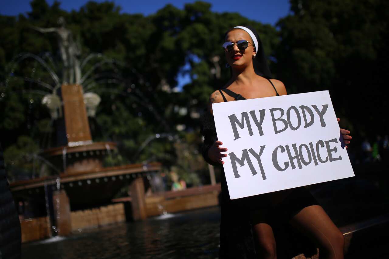 A protester holds a placard during the Our Body Our Choice march in Sydney, earlier this month.