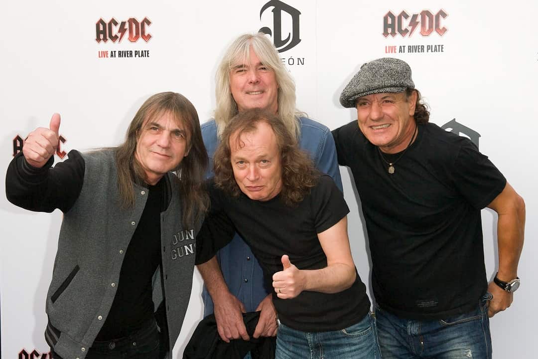 From left: AC/DC band members Malcolm Young, Cliff Williams, Angus Young and Brian Johnson.