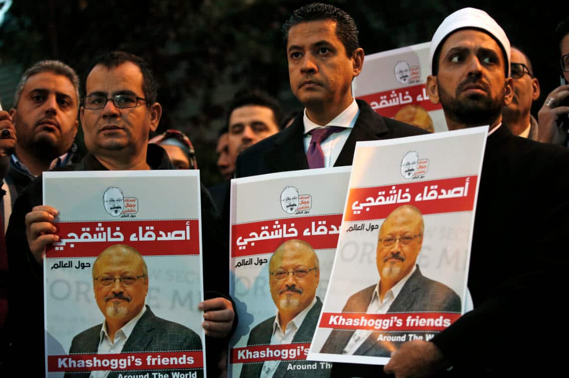 Activists protesting the killing of Saudi journalist Jamal Khashoggi hold a candlelight vigil outside Saudi Arabia's consulate in Istanbul, Thursday, Oct. 25, 2018. 