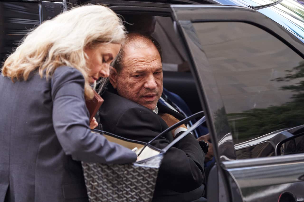 Disgraced movie producer Harvey Weinstein (R), leaves New York State Supreme Court.