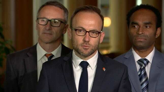 Greens leader Adam Bandt, Greens Senator Richard Di Natale and West Papuan Activist Ronny Kareni.
