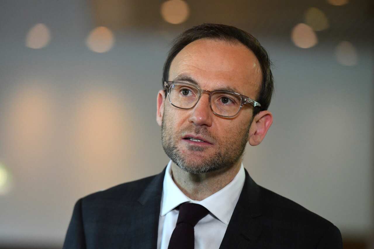 Greens leader Adam Bandt wearing a suit and tie 