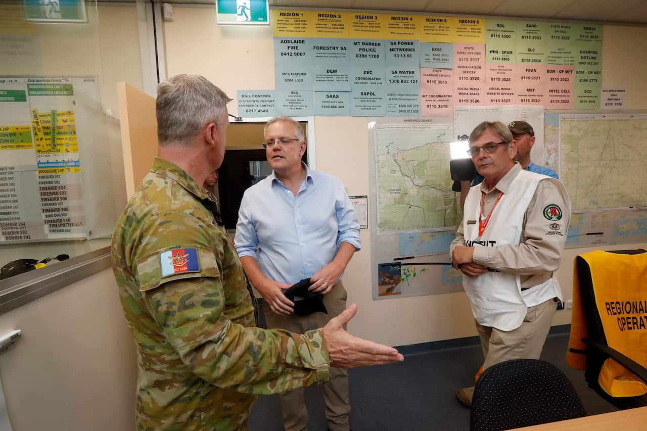 Prime Minister Scott Morrison is briefed by CFS volunteers and the military at the Mt Barker CFS HQ in Mount Barker.