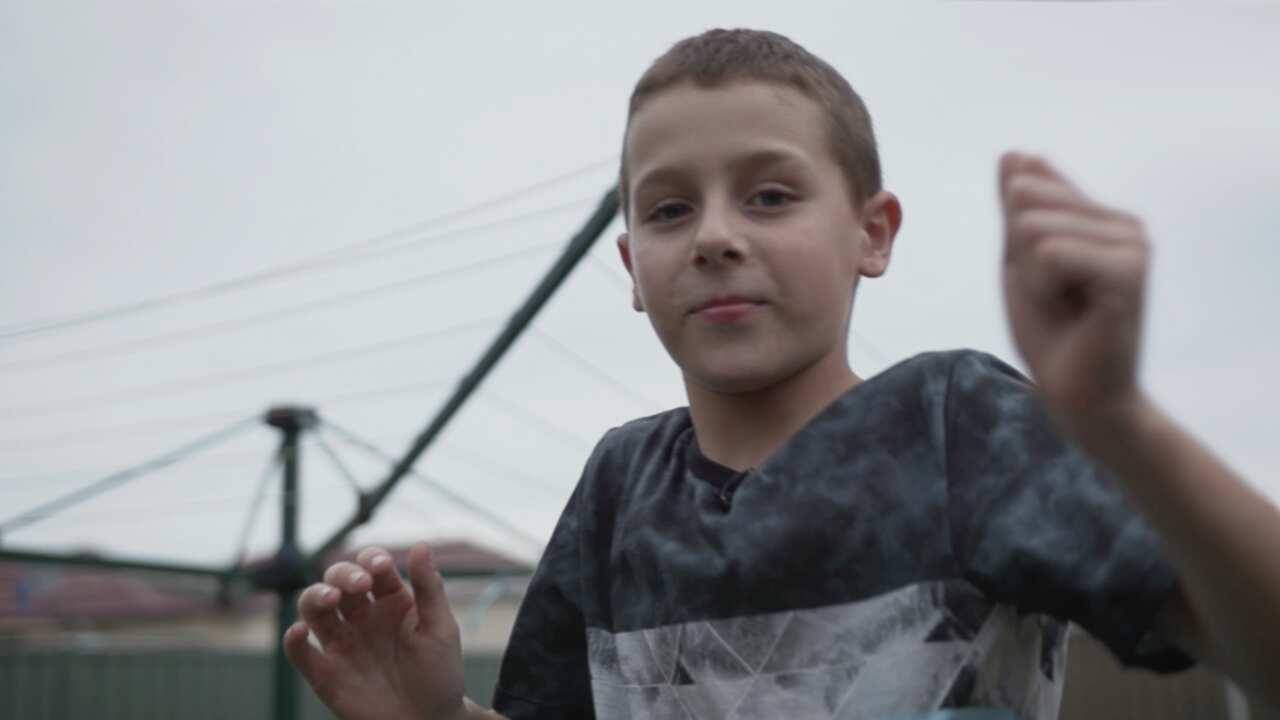 Ashton plays in his backyard