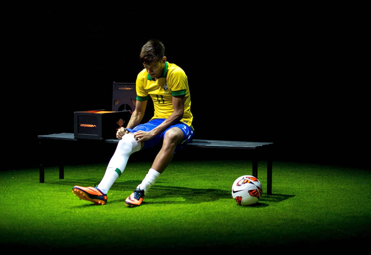 Brazilian football star Neymar presents his new Nike football boots.
