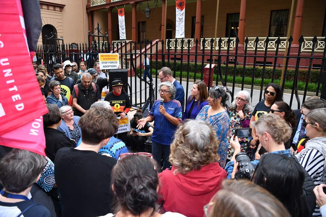 Protesters are seen at the Stop Forced Adoptions: Reject the Child Protection Bill Protest outside Parliament House in Sydney, Wednesday, November 14, 2018. (AAP Image/Joel Carrett) NO ARCHIVING
