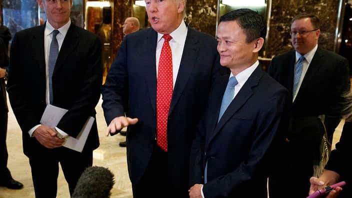 President-elect Donald Trump stands with Alibaba Executive Chairman Jack Ma as he speaks with reporters after a meeting at Trump Tower in New York, Monday, Jan. 9, 2017. (AP Photo/Evan Vucci)