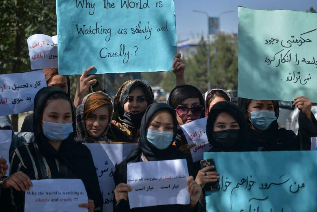 Afghan women hold banners and placards as they take part in an anti-Pakistan protest in Kabul on September 8, 2021.