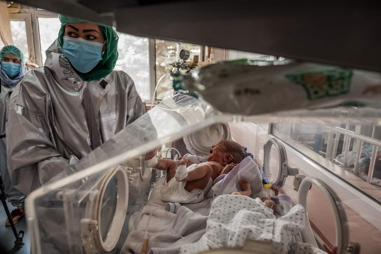 Nurses with newborns at Ataturk hospital in Kabul, Afghanistan, Wednesday, May 13, 2020. (Jim Huylebroek/The New York Times)