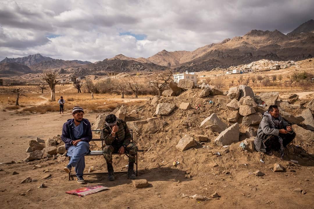 A commando who returned from the front line breaks down in tears outside a hospital  in Sang-e-Masha, Afghanistan
