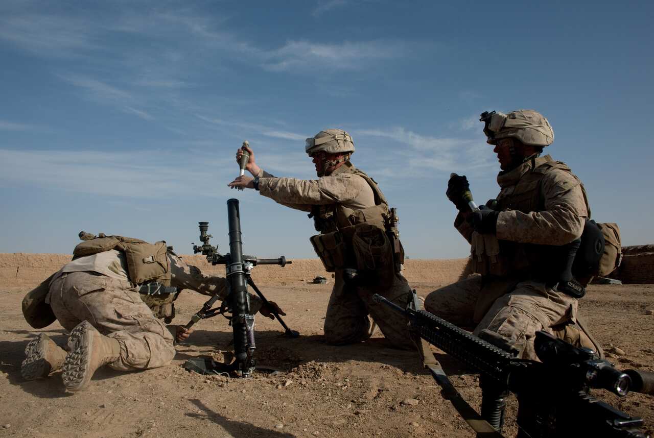 U.S. Marines prepare to fire on a Taliban position near Marja, Afghanistan, on Feb. 17, 2010.