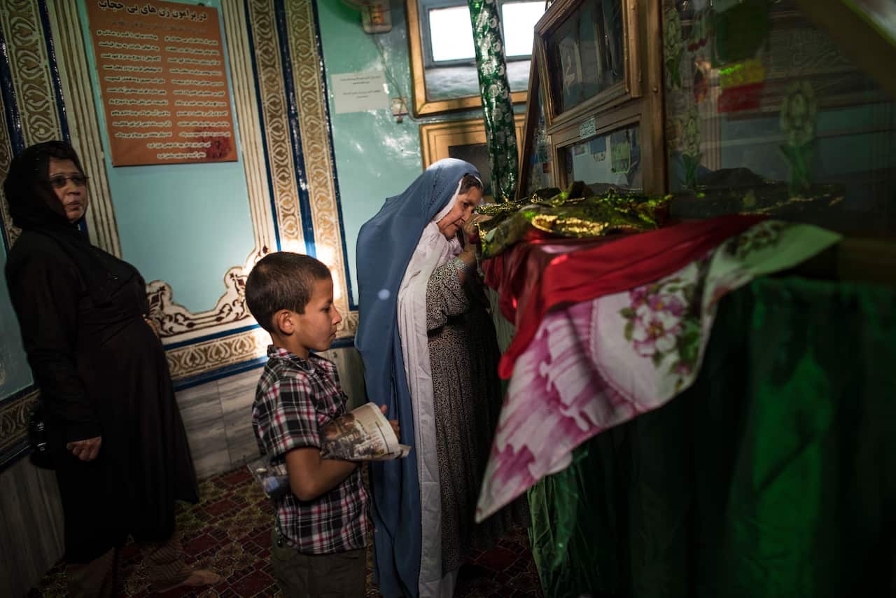 Afghan women praying at the Shah do Shamshera Shrine, known as the Shrine of the King of Two Swords, where female islamic scholar Farkhunda was beaten to death, in Kabul, Afghanistan.