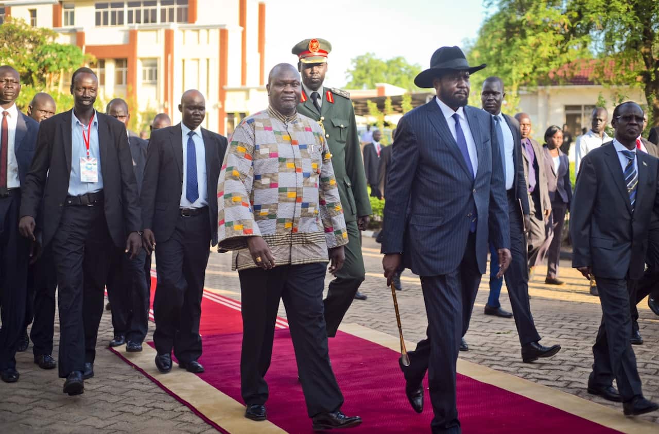 South Sudan's rebel leader and now Vice President Riek Machar, center-left, walks with President Salva Kiir, center-right, in April 2016