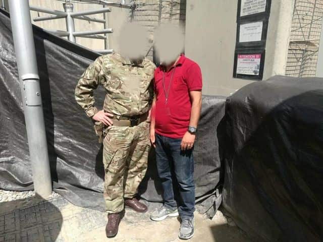 Ahmad with a British soldier in Afghanistan.