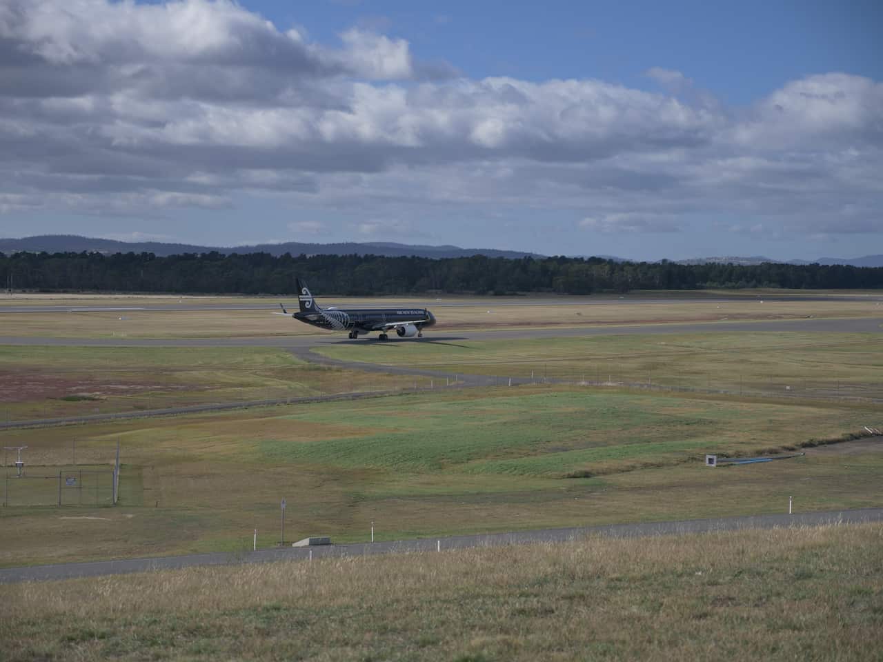 The Air New Zealand flight arrives in Hobart.