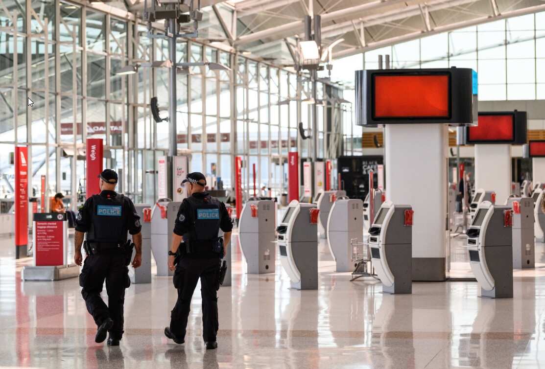 Police Officers patrolling in the Departures Hall of Sydney Domestic Airport.