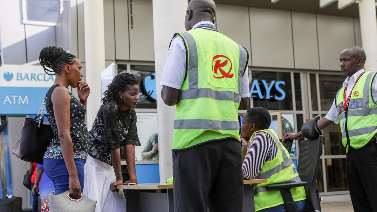 Relatives talk to airport staffat a help desk set up for the crashed Ethiopian Airlines flight ET 302.