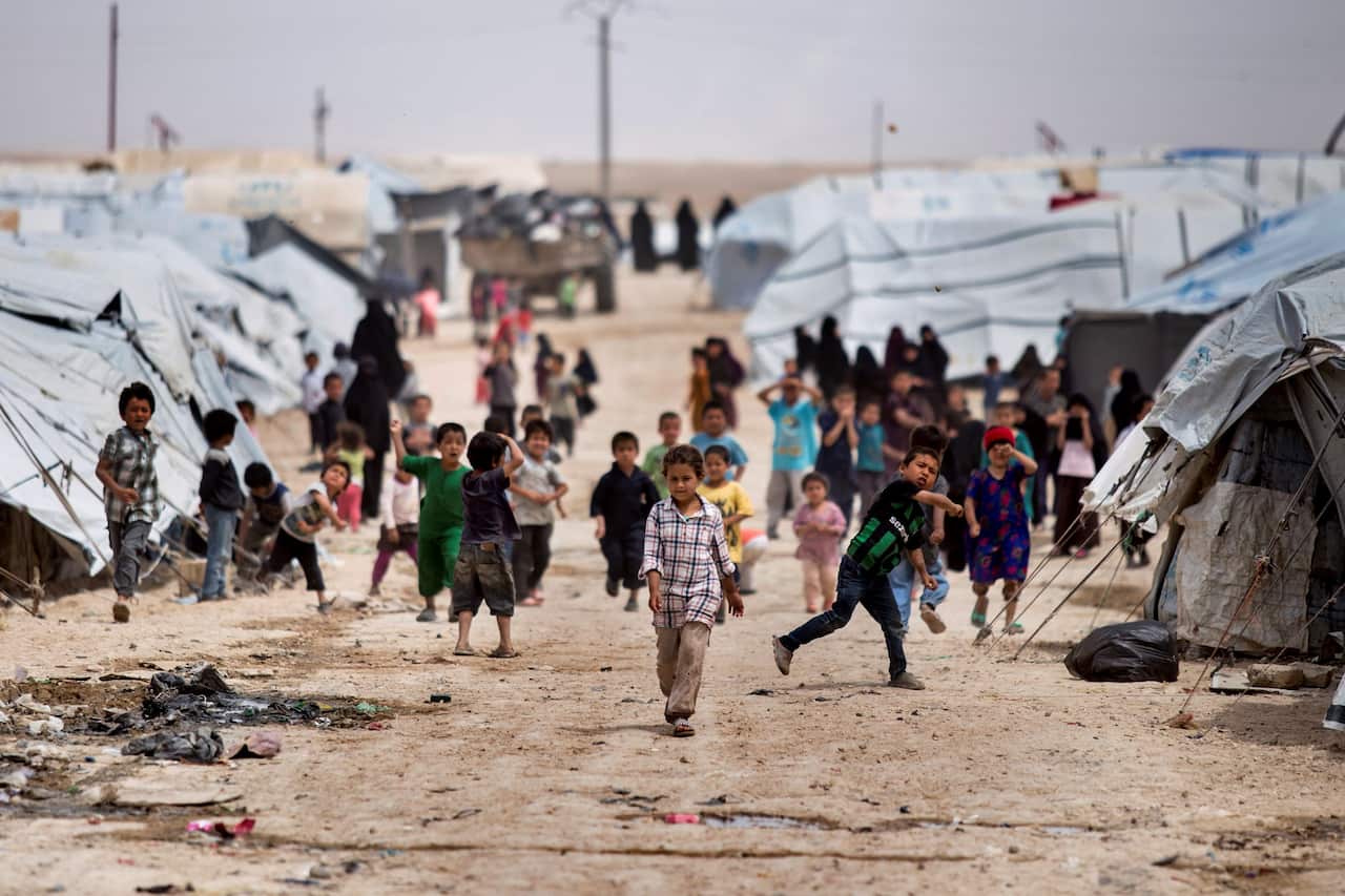 Children gather outside their tents, at al-Hol camp, which houses families of members of the Islamic State group, in Hasakeh province, Syria.