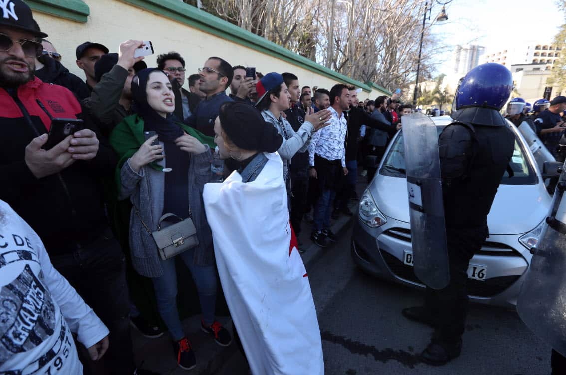Algerian protesters chant slogans during a protest against the fifth term of Abdelaziz Bouteflika outside of the Constitutional Council building, in Algiers, Algeria (AAP)