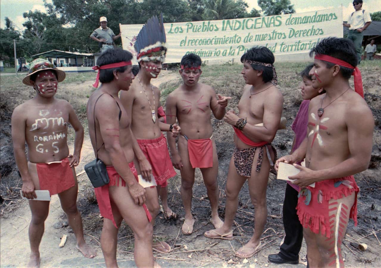 Pemon people gather at the site of a roadblock in 1998, protesting the building of roads and powerlines through the Amazon of eastern Venezuela.