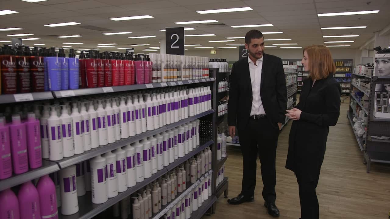 Ammar with SBS Reporter Hannah Sinclair at one of his bricks-and-mortar stores.